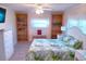 Spacious bedroom with queen bed, wood shelving, and light flooring at 1401 W Highway 50 # 138, Clermont, FL 34711