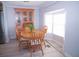 Bright dining area with wooden table and chairs, near a window at 1401 W Highway 50 # 138, Clermont, FL 34711