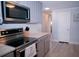 Modern kitchen with stainless steel appliances and white quartz countertops at 1401 W Highway 50 # 138, Clermont, FL 34711