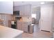 Modern kitchen with stainless steel appliances and gray cabinets at 1401 W Highway 50 # 138, Clermont, FL 34711