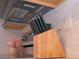 Modern kitchen with a block tile backsplash and wooden knife block at 1401 W Highway 50 # 138, Clermont, FL 34711