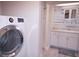 Laundry room with washer, dryer, and cabinets at 1401 W Highway 50 # 138, Clermont, FL 34711