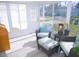 Bright sunroom with wicker furniture and large windows at 1401 W Highway 50 # 138, Clermont, FL 34711