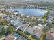 Community overview featuring a lake and various houses at 14783 Yorkshire Run Dr, Orlando, FL 32828