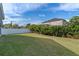 Large backyard with lush lawn and privacy fence at 14783 Yorkshire Run Dr, Orlando, FL 32828