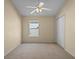 Simple bedroom with neutral walls, carpet, and ceiling fan at 14783 Yorkshire Run Dr, Orlando, FL 32828