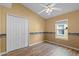 Bright bedroom with wood-look floors and double doors at 14783 Yorkshire Run Dr, Orlando, FL 32828