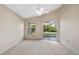 Spacious bedroom with sliding glass doors leading to the backyard at 14783 Yorkshire Run Dr, Orlando, FL 32828