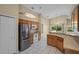 Bright kitchen with stainless steel appliances and light wood cabinets at 14783 Yorkshire Run Dr, Orlando, FL 32828