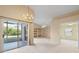 Living room with built-in shelving and access to the backyard at 14783 Yorkshire Run Dr, Orlando, FL 32828