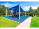 playground with shade structure and seating at 14783 Yorkshire Run Dr, Orlando, FL 32828