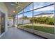 Screened porch overlooking backyard with ceiling fan at 14783 Yorkshire Run Dr, Orlando, FL 32828