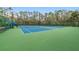 Two well-maintained tennis courts at 14783 Yorkshire Run Dr, Orlando, FL 32828