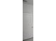 White bathroom with a door to the hallway at 15322 Sw 50Th Court Rd, Ocala, FL 34473