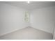 Simple bedroom with a single window and light colored floors at 15322 Sw 50Th Court Rd, Ocala, FL 34473
