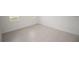 Bright bedroom with tile floors and large window at 15322 Sw 50Th Court Rd, Ocala, FL 34473