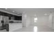 Bright, open kitchen and living area featuring stainless steel appliances and modern finishes at 15322 Sw 50Th Court Rd, Ocala, FL 34473