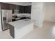 Open-concept kitchen with a large island, granite countertops, and stainless steel appliances at 15322 Sw 50Th Court Rd, Ocala, FL 34473