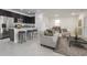 Open-concept living room flows seamlessly into the kitchen with modern appliances and a breakfast bar at 15322 Sw 50Th Court Rd, Ocala, FL 34473