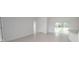 Spacious living area featuring tile floors and backyard access at 15322 Sw 50Th Court Rd, Ocala, FL 34473