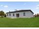 A spacious backyard features a well-maintained lawn with a concrete patio at 15568 Sw 46Th Cir, Ocala, FL 34473