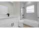 Bathroom featuring shower-tub combo, modern vanity, and matte black fixtures at 15568 Sw 46Th Cir, Ocala, FL 34473