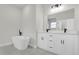Bathroom featuring double vanity, soaking tub, and modern fixtures at 15568 Sw 46Th Cir, Ocala, FL 34473