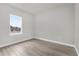 Charming bedroom with a window and wood-look flooring at 15568 Sw 46Th Cir, Ocala, FL 34473