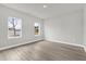 Spacious bedroom with two windows and hardwood floors at 15568 Sw 46Th Cir, Ocala, FL 34473