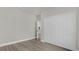 Bedroom with a large closet and light wood-look flooring throughout at 15568 Sw 46Th Cir, Ocala, FL 34473