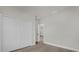 Bedroom with a closet featuring double doors, light-colored walls, and modern baseboards at 15568 Sw 46Th Cir, Ocala, FL 34473