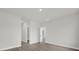 Hallway with neutral paint and trim provides access to the bedrooms and bathrooms at 15568 Sw 46Th Cir, Ocala, FL 34473