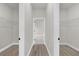 Hallway with two large closets and light flooring at 15568 Sw 46Th Cir, Ocala, FL 34473