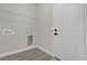 Clean laundry room featuring a utility sink connection and wire shelving at 15568 Sw 46Th Cir, Ocala, FL 34473