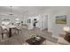 Open-concept living space featuring a kitchen, dining area, and a bright and airy living room at 15568 Sw 46Th Cir, Ocala, FL 34473