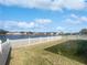 Lake view from backyard with white picket fence at 161 Pinefield Dr, Sanford, FL 32771