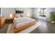 Bright bedroom with a large window and wood platform bed at 161 Pinefield Dr, Sanford, FL 32771