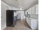 Modern kitchen with white cabinets and stainless steel appliances at 161 Pinefield Dr, Sanford, FL 32771