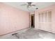 Simple bedroom with light pink walls and closet at 1950 Baton Rouge Ct, Orlando, FL 32818