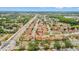 An aerial view showcases this property's location in a vibrant neighborhood near amenities, easy highway access, and lakes at 2317 Santa Lucia St, Kissimmee, FL 34743