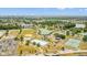 An aerial view of the local neighborhood park with baseball field, skating rink, tennis courts, and serene lake views at 2317 Santa Lucia St, Kissimmee, FL 34743