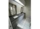 Modern bathroom with double vanity and granite countertops at 2317 Santa Lucia St, Kissimmee, FL 34743