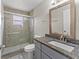 Bathroom featuring a glass shower and granite vanity at 2317 Santa Lucia St, Kissimmee, FL 34743