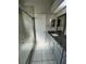 Updated bathroom with a walk-in shower and gray cabinets at 2317 Santa Lucia St, Kissimmee, FL 34743