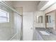 Bathroom featuring a glass-enclosed shower and granite counters at 2317 Santa Lucia St, Kissimmee, FL 34743