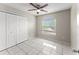 Bedroom with tile floors, window and closet at 2317 Santa Lucia St, Kissimmee, FL 34743