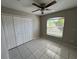 Bright bedroom with double door closet and a window with blinds at 2317 Santa Lucia St, Kissimmee, FL 34743