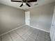 Spacious bedroom with ceiling fan, tile floors, and neutral wall color at 2317 Santa Lucia St, Kissimmee, FL 34743