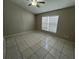 Bright bedroom featuring tile flooring and a ceiling fan at 2317 Santa Lucia St, Kissimmee, FL 34743