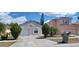 Two-story home with a one-car garage and landscaped yard at 2317 Santa Lucia St, Kissimmee, FL 34743